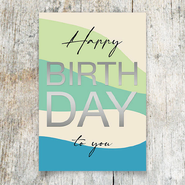 Vergrößerte Abbildung Geburtstagskarte mit geschwungenen Balken in Mint, Grün und Blau und silberfoliengeprägtem Birthday-Schriftzug auf glattem Karton